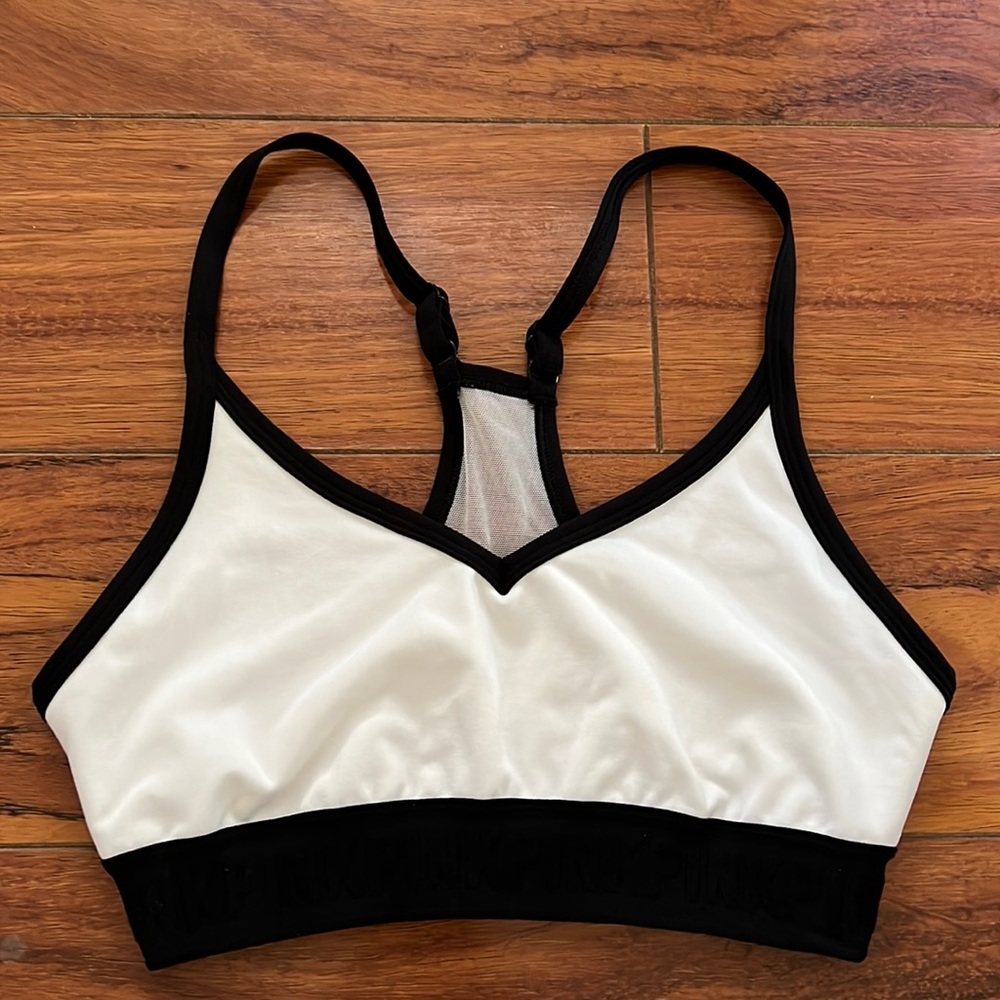 White sports bra with black trim by PINK